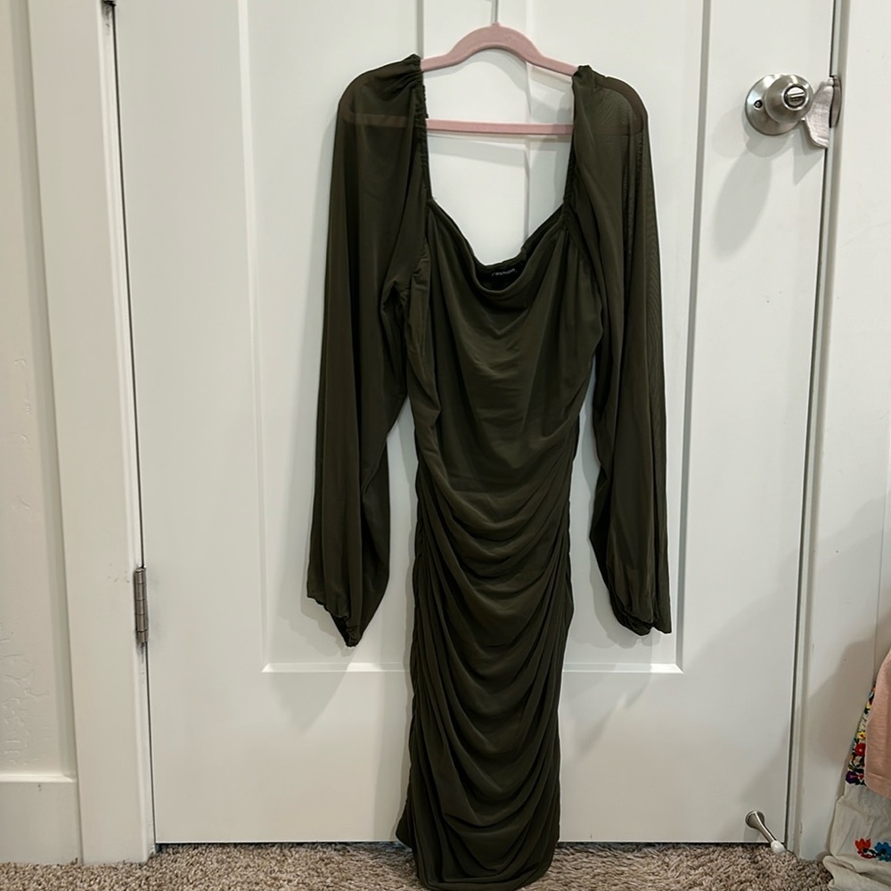 Green bodycon ruched dress.